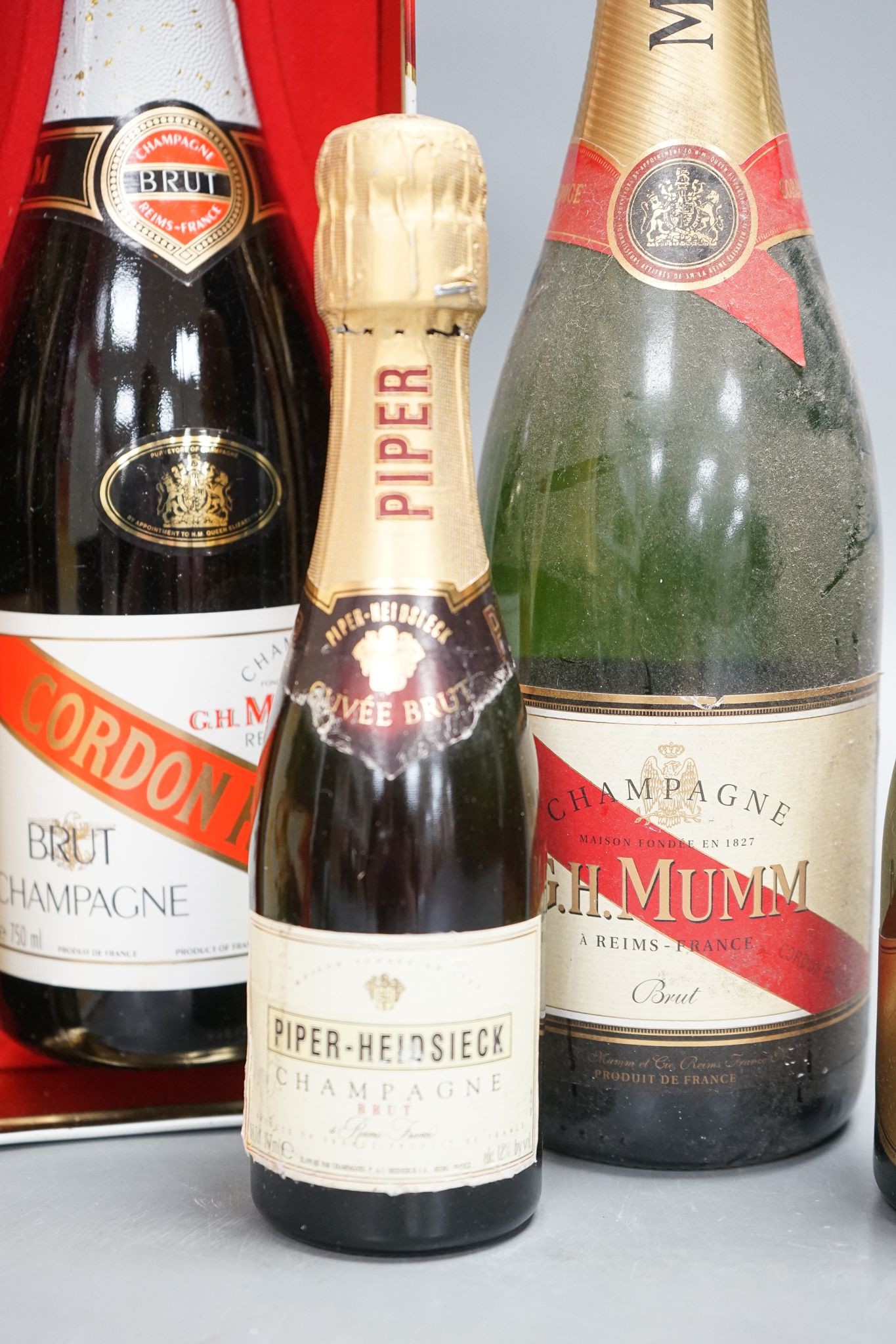 Two bottles of Mumm champagne and two small bottles of champagne
